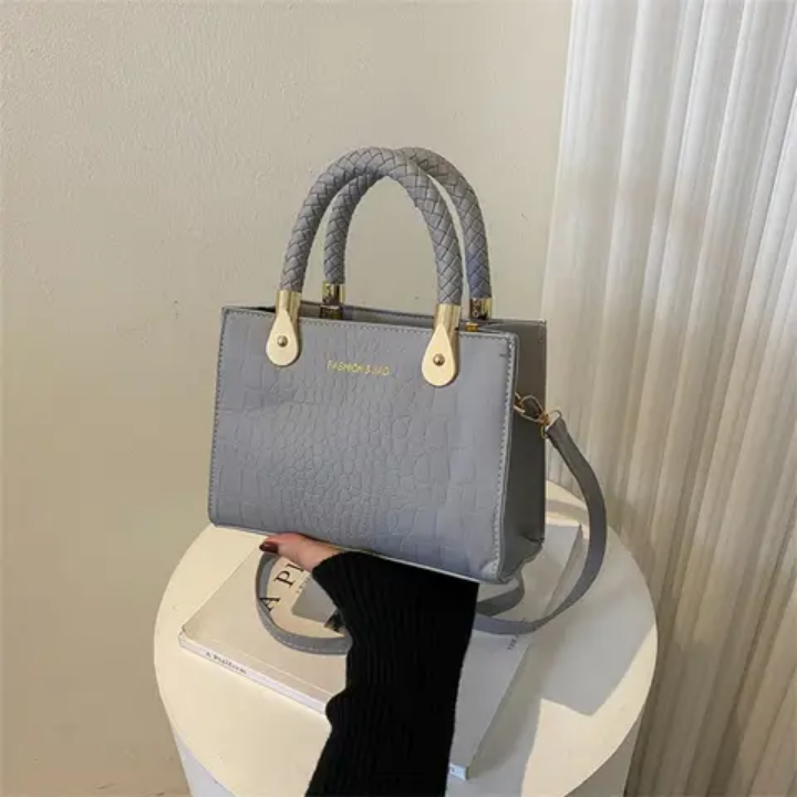 Sac à main vert croco tendance avec poignées tressées et chaîne réglable